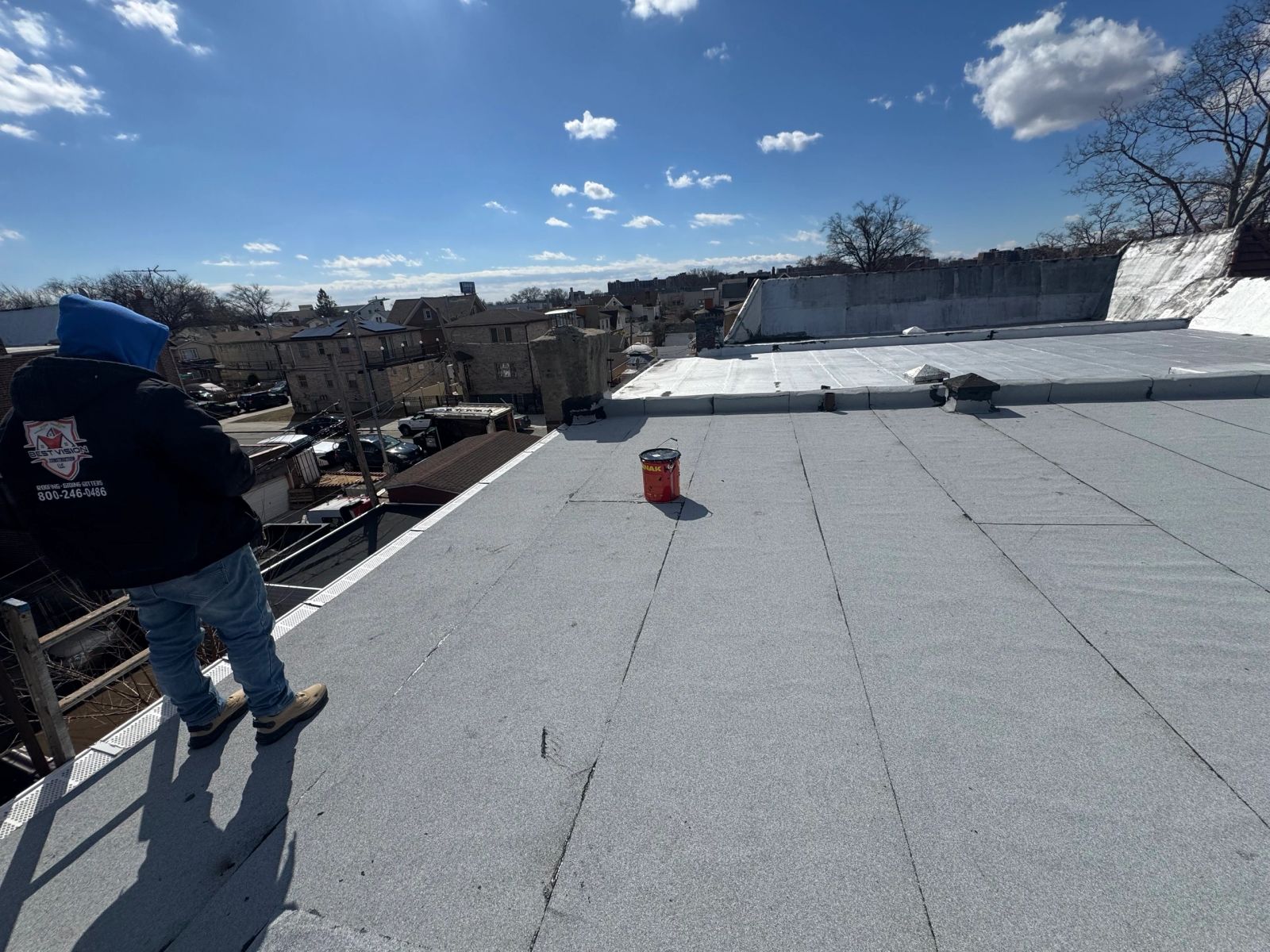 Completed white torch-down flat roof membrane