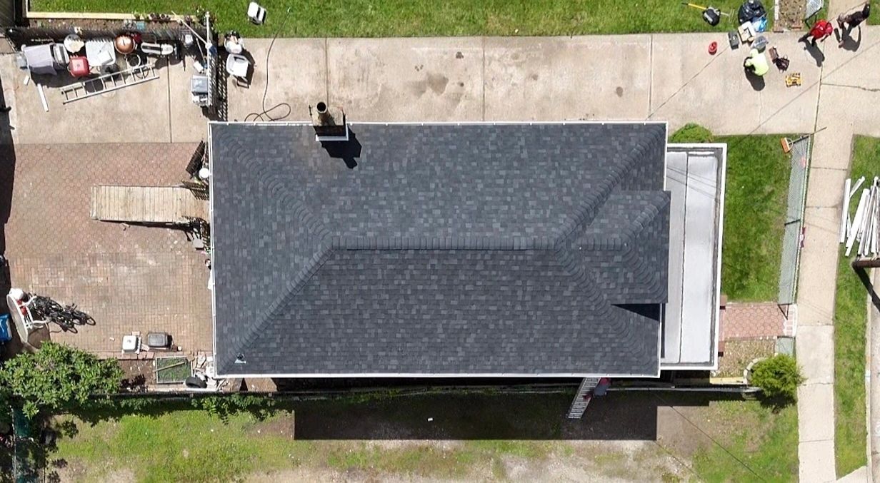 Aerial view of a completed architectural shingle roof